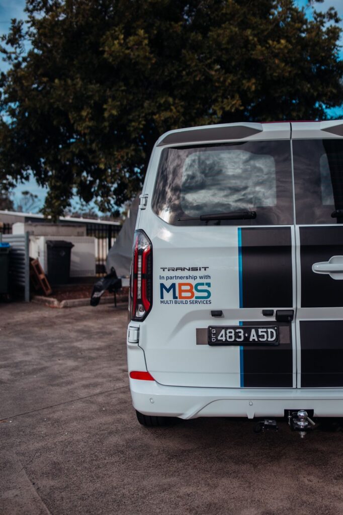 Rear of a Claymill Transit van showing the Multi Build Services partnership